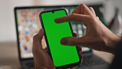 Fingers zooming chroma key cellphone in office closeup. Unknown man shopping 