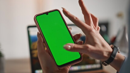 Girl fingers zooming mockup smartphone watching social media at home closeup.