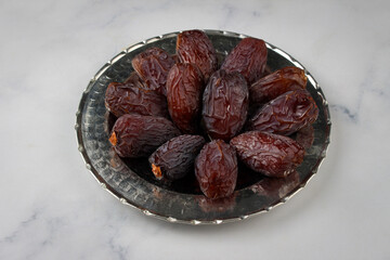 Close up of fresh date fruit in a bowl on table