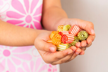 Hard candies, little girl holding bowl of hard candies. Traditional Ramadan or Ramazan feast...