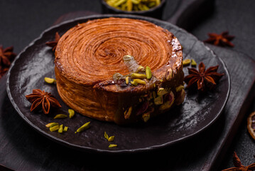 Round puff pastry croissant with pistachio filling or new york roll