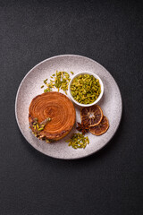 Round puff pastry croissant with pistachio filling or new york roll