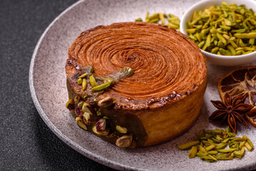 Round puff pastry croissant with pistachio filling or new york roll