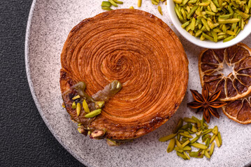 Round puff pastry croissant with pistachio filling or new york roll