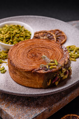 Round puff pastry croissant with pistachio filling or new york roll