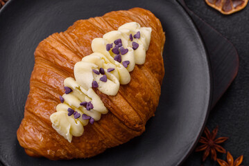 Sweet crispy fresh croissant with berry filling