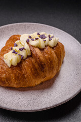 Sweet crispy fresh croissant with berry filling