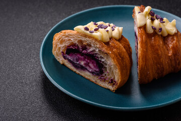 Sweet crispy fresh croissant with berry filling