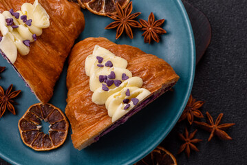 Sweet crispy fresh croissant with berry filling
