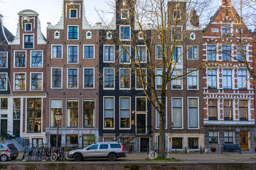 Colorful facades of typical Amsterdam houses along the canal
