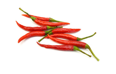 Stack red chili peppers and basil herb leaves  on the white