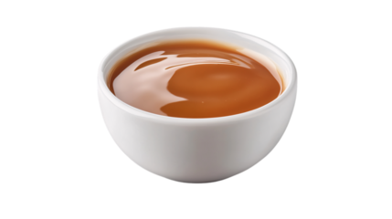 Creamy caramel sauce in white bowl isolated on transparent background --ar 16:9