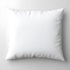 A square white pillow rests on a plain gray and white surface