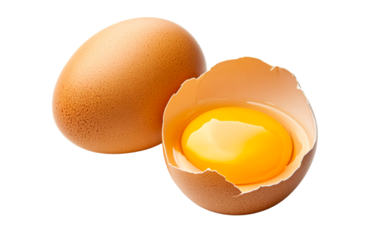 Fresh brown egg with cracked shell and yolk on transparent background