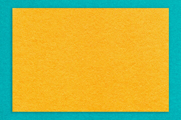 Texture craft yellow color paper background with blue border, macro. Structure vintage kraft orange cardboard