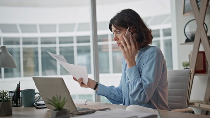 Busy worker speaking telephone explaining work issue in laptop office closeup. 