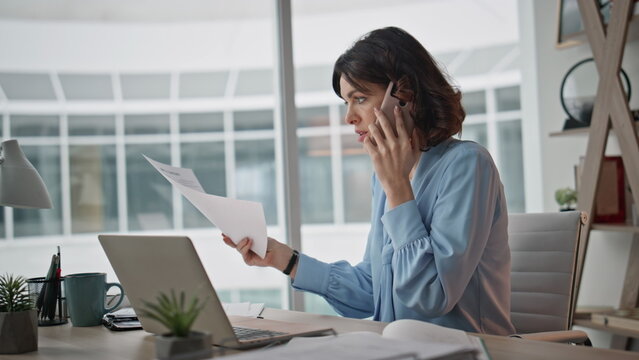 Busy worker speaking telephone explaining work issue in laptop office closeup. 