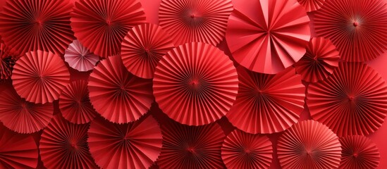 Red paper fans overlapping and covering an entire colorful background scene