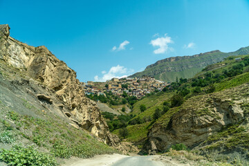 Village of Chokh in Dagestan. Facades of houses located in tiers on a steep slope, summer landscape.