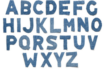 A unique set of isolated cut-out blue jeans denim alphabet letters, showcasing stylish shadows. Perfect for creative projects, these textured letters add a trendy, casual touch to designs and crafts.
