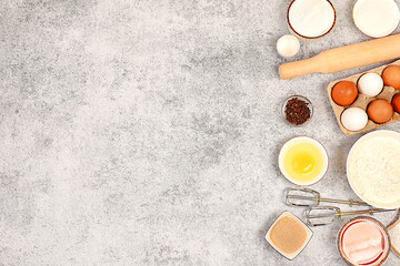 Cooking ingredients for making pie and bread, recipe with eggs, flour, sugar, honey, cinnamon, yeast and butter. Kitchen background of food preparation with space for text. Concept of modern bakery,