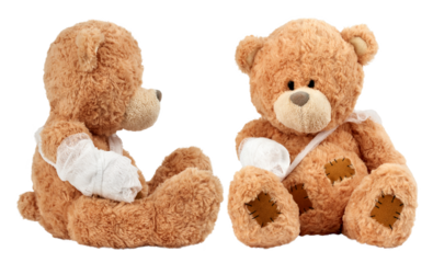 Soft brown teddy bears sitting with bandaged arms and visible stitched patches, symbolizing care, recovery, and support.