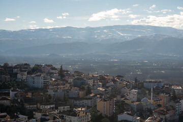 Generated iValley Town with Snow-Capped Mountain Backdrop