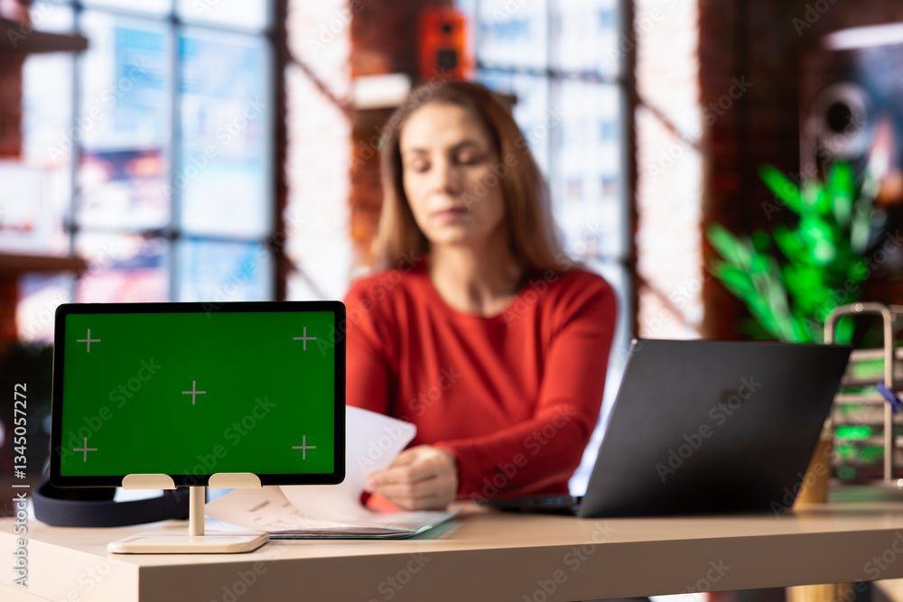 Aufkleber freelancer does research by reading articles and papers next to chroma key display, collecting infor