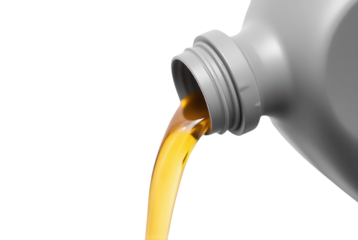 Pouring Golden Liquid from Plastic Bottle