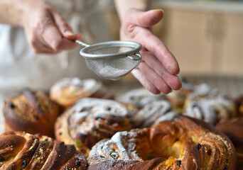 Sprinkling Powdered Sugar on Easter Bread