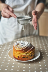 Sprinkling Powdered Sugar on Easter Bread