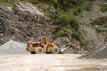 Yellow Front-End Loader at a Rocky Site