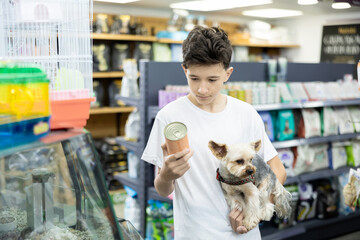 Guy are preparing for appearance and purchase of pet and new family member, boy buying all...
