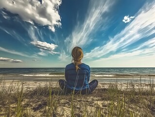 Serene female practicing yoga near ocean waves, meditating with mindful posture against cloudy coastal landscape, embodying wellness and tranquility