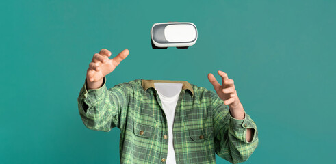 A person is interacting with virtual reality goggles, with no head or face visible. The individual...