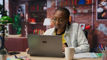 Overworked freelancer in apartment trying to relax, closing eyes after working too much on laptop. Remote worker feeling eye strain, getting overstimulated while working from home, camera B