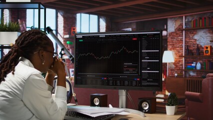 Day trader reacting with frustration after losing money in cryptocurrency investment due to rug pull. Woman suffering emotional toll of financial loss after trading plummeting crypto coin, camera A