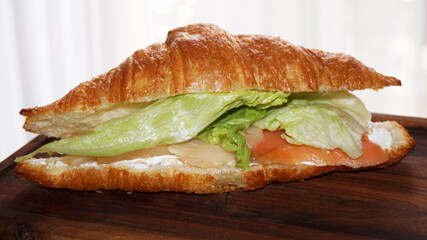 croissant with salad and salmon