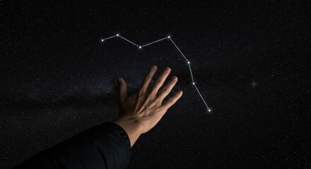 Fototapeta premium Exploring the Stars: A Hand Reaching Out to the Night Sky Constellation for Astronomy Enthusiasts and Stargazers.