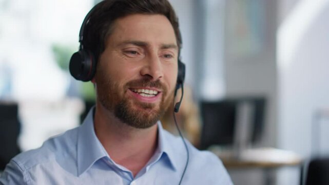 Call center representative helping client looking computer in office closeup.