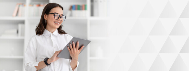 Glad young caucasian businesswoman in white shirt and glasses chatting on tablet in office interior. Business and gadget for work, official lifestyle, app and ad, offer, startup