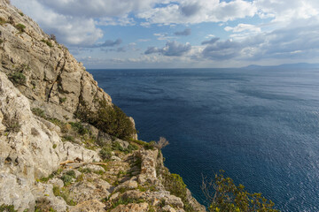 Fototapeta premium Hiking path at beautiful rocky landscape of mediterranean coastline at cape Maleas, Laconia, Peloponnese, Greece