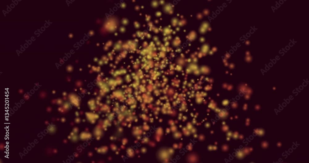 Aufkleber animation showing glowing particles floating in warm colors against dark background