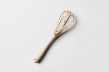 Beige wooden whisk on a white background