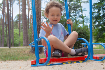 Curly child for swing in the park