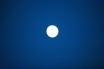 Full moon in a dark blue sky
