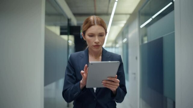 Woman making notes tablet on go closeup. Disappointed lady manager feeling mad