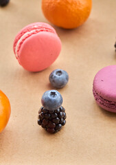 Vibrant Macarons with Fresh Berries and Oranges