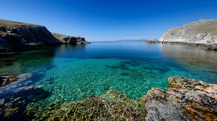 Transparent Turquoise Water and Rocky Coastline under Clear Blue Sky on a Bright Day