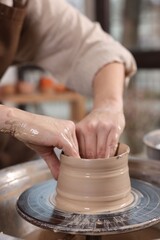 Hobby and craft. Woman making pottery indoors, closeup